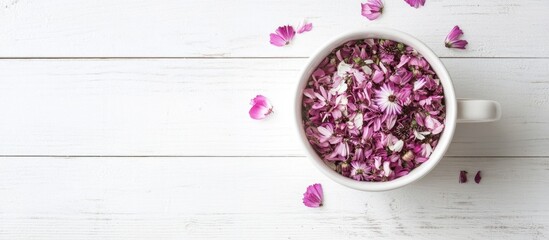 Aufkleber - Cup filled with aster flower petals on a white wooden table Minimalist flat lay composition for nature and wellness themes