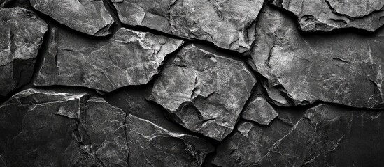 Poster - Dark textured stone background with layered surfaces providing contrast and ample space for text or graphic design elements.