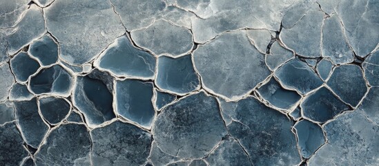 Fototapete - Detailed closeup of a textured concrete wall showcasing diverse patterns and variations in surface elements ideal for backgrounds and design.