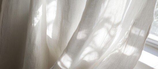 Poster - Soft white linen curtain texture illuminated by natural light creating a serene and calming atmosphere in interior decor settings.