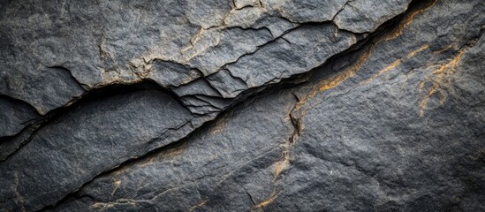 Poster - Closeup of rugged stone texture showcasing intricate patterns ideal for backgrounds and backdrops in various design projects