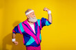 © deagreez - Photo of cool positive mature guy dressed retro sport jacket showing muscles emtpy space isolated yellow color background