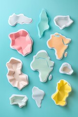 Aufkleber - colorful abstract shapes resembling continents arranged on a turquoise background for creative use