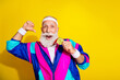 © deagreez - Photo of funny aged sportsman point finger himself hold medal retro uniform isolated on yellow color background