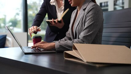 Businessmen team or financial data analysts working with tablets and laptop computers and data graphs together. Plan to analyzing projects in the office.