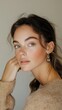 © Evon J - Young caucasian female with earrings in thoughtful pose National Silly Earring Day