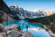 © Matteo Colombo - Man at Moraine lake at sunrise, Banff, Canada