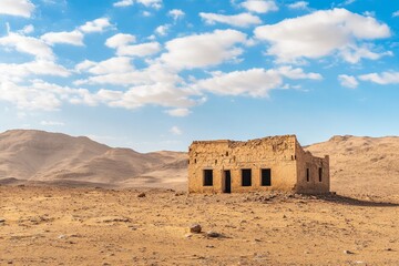 Wall Mural - Desert Ruin Abandoned mud-brick house, sunny day, mountain backdrop, travel photography