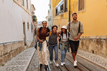 tourists walking down a narrow street in lisbon, portugal