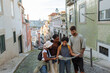© bernardbodo - Tourists consulting map on famous district, lisbon, portugal