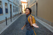 © bernardbodo - Young tourist exploring european city with yellow backpack