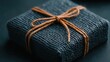 © Giman - Dark grey gift box tied with twine, dark background, gift-giving occasion