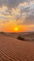 Aufkleber - As the sun dips below the horizon, the desert transforms into a canvas of gold and orange. Silhouetted dunes showcase intricate patterns under a colorful sky, inviting tranquility and reflection