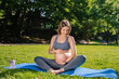 © zinkevych - Young woman on a third pregnancy trimester having her lunch in the park