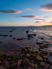 Wall Mural - long exposure view of rocky seascape at dusk.
