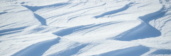 Wall Mural - snow texture. wind sculpted patterns on snow surface. wind in the tundra and in the mountains on the