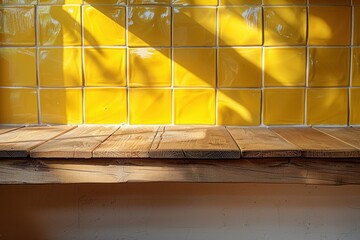 Wall Mural - Warm wooden countertop under sunlight with bright yellow tiled wall in urban cafe setting during morning hours