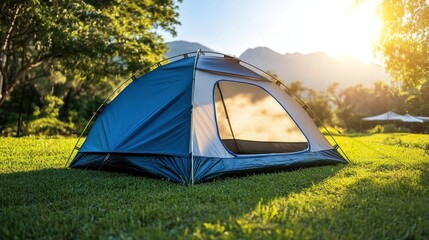 Poster - A vibrant camping tent set in a lush green landscape during sunset.