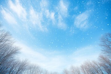 Aufkleber - Delicate snowflakes drift downwards in a pale blue sky, enhancing the tranquil winter landscape with faint tree branches softly visible at the bottom of the view