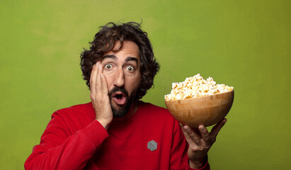 Sticker - young adult bearded man. popcorns and movie concept