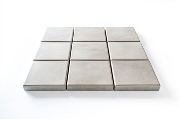 Poster - Ceramic tiles arranged on a clean white background showcasing modern design and texture details