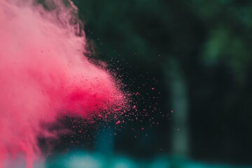 Poster - A vibrant burst of crimson powder explodes mid-air, showcasing intense motion and energy against a dark background, with ample space for text