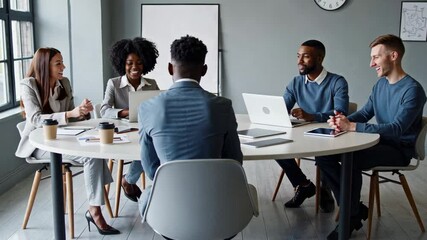 Aufkleber - Diverse professional team collaborating during slow motion meeting, sharing innovative ideas and discussing strategic project goals in modern workplace environment
