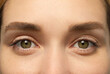 © New Africa - Closeup view of woman with green eyes