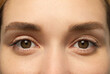 © New Africa - Closeup view of woman with brown eyes