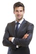 © imagemir - Man in a suit smiles confidently with arms crossed against a white background, projecting professionalism and approachability