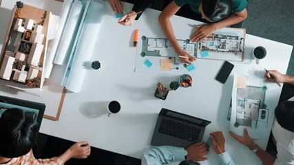 Poster - top aerial view business people brainstorming about building interior at table with house model and 