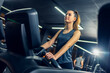 © Mediteraneo - Girl walks on a treadmill in the gym.