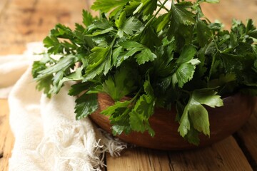 Wall Mural - Fresh green parsley on wooden table, closeup