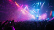 © mahamad - A concert crowd enjoying colorful stage lights and confetti.