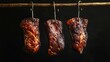 © Nick Alias - Smoked Meat Hanging on Hooks Against Dark Background in Rustic Style