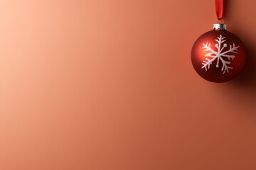 Aufkleber - A red Christmas ornament adorned with white snowflakes dangles from a ribbon, set against a solid pastel backdrop that enhances the holiday spirit