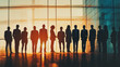 © Teeraphon - Group of business people silhouettes in modern office building and business network concept. Human resources with pastel innovation charts and graphs with statistics to analyze business