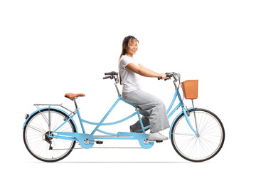 Wall Mural - Young asian woman riding a tandem bicycle