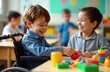 © Vadym - Boy child in wheelchair plays with friends at school table. Happy children play with colorful toys. Inclusion, diversity in special needs education. Joyful playtime in supportive learning environment.