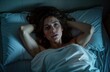 © Vadym - Young woman lies in bed looking worried. Trouble sleeping due to insomnia. Unhappy, stressed. Room dark, peaceful in bedroom. Night time. Seems to anxiety. Sleeplessness affects badly. Difficulty