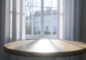 Sticker - A round light brown wooden table is placed in front of a window with white curtains. Sunlight streams through, creating a bright and airy ambiance