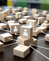 Concept of business networking, human connection, and social structure with wooden blocks linked by white lines, representing teamwork, communication, and organizational relationships


