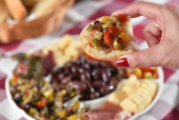 portion of olives with cheese cherry tomatoes and parma ham snack healthy food vegan salad