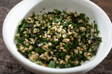 Wall Mural - A closeup view of a condiment cup of furikake.