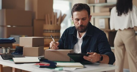 Poster - Box, writing and man with tablet in workshop with information for delivery, shipping or courier. Ecommerce, package and small business owner with order label on cardboard parcel for cargo service.
