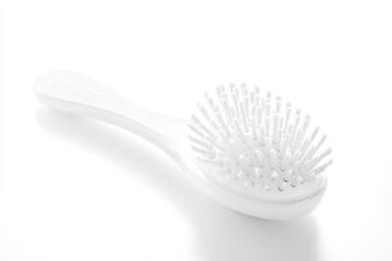 Poster - A single white brush lies flat on a white surface