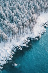 Aufkleber - Aerial view of a river surrounded by trees covered in snow, perfect for winter scenery or landscape photography