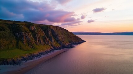 Aufkleber - A serene coastal landscape featuring cliffs and a tranquil sea, illuminated by soft sunset hues.