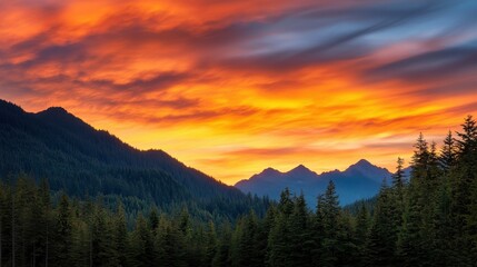 Poster - A vibrant sunset casts warm hues over a tranquil forest and mountains, creating a picturesque natural landscape.