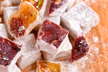 Wall Mural - Sweet food Turkish delight, assorted rahat locum in form of cubes with nuts and powdered sugar, traditional food